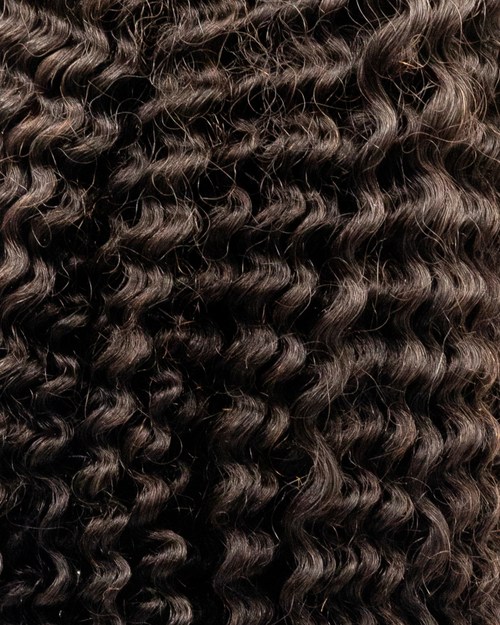 Curly hair extension with clips on a white background